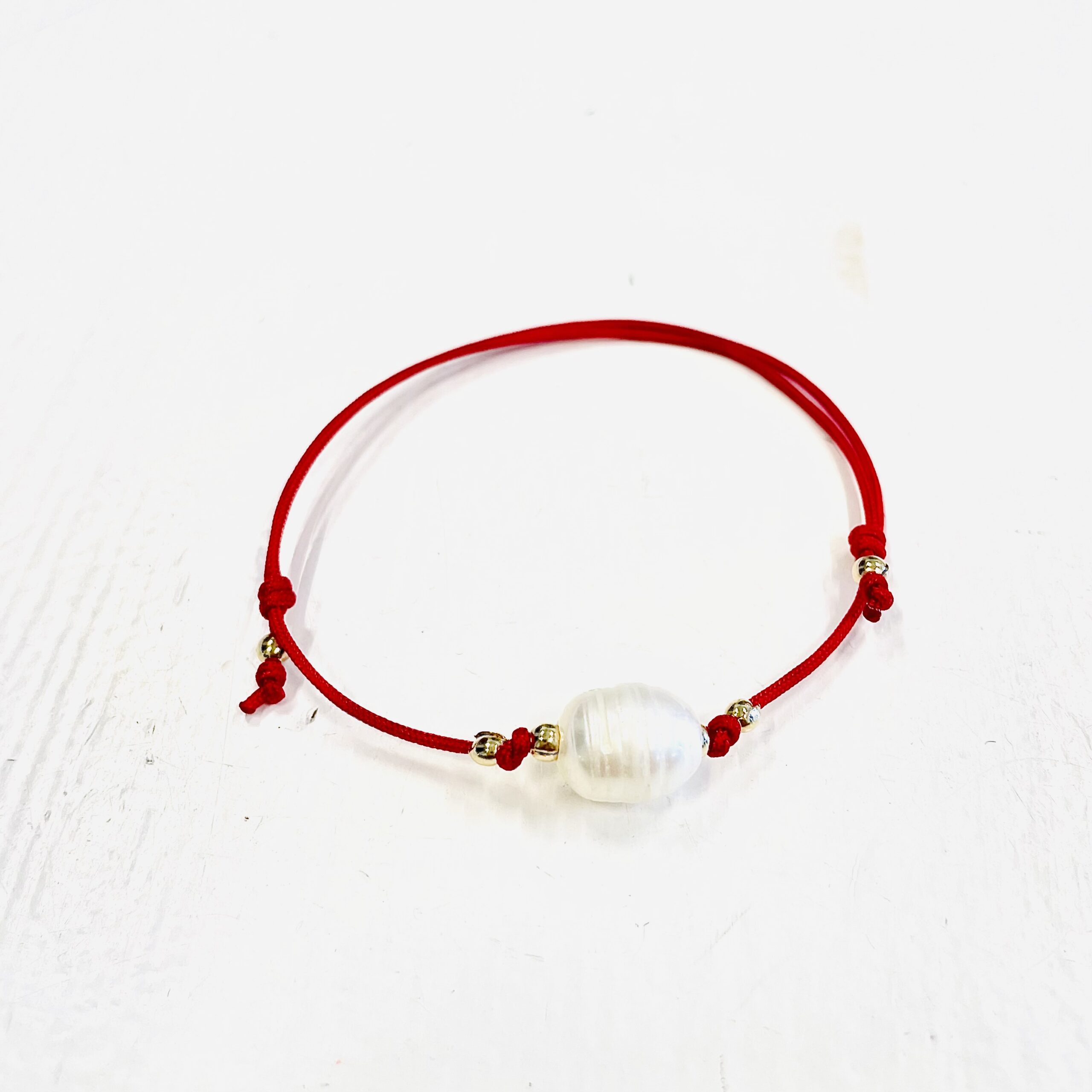 Bracelet with red ribbon and pearl 3 Bracelet with red ribbon and pearl